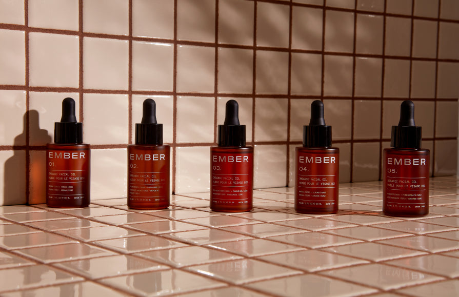 Five cold-pressed, organic facial oils from two synergistic plant oils, amplified formulations that are greater than the sum of their parts. Picture here, all five Ember oils rest on a tiled surface.