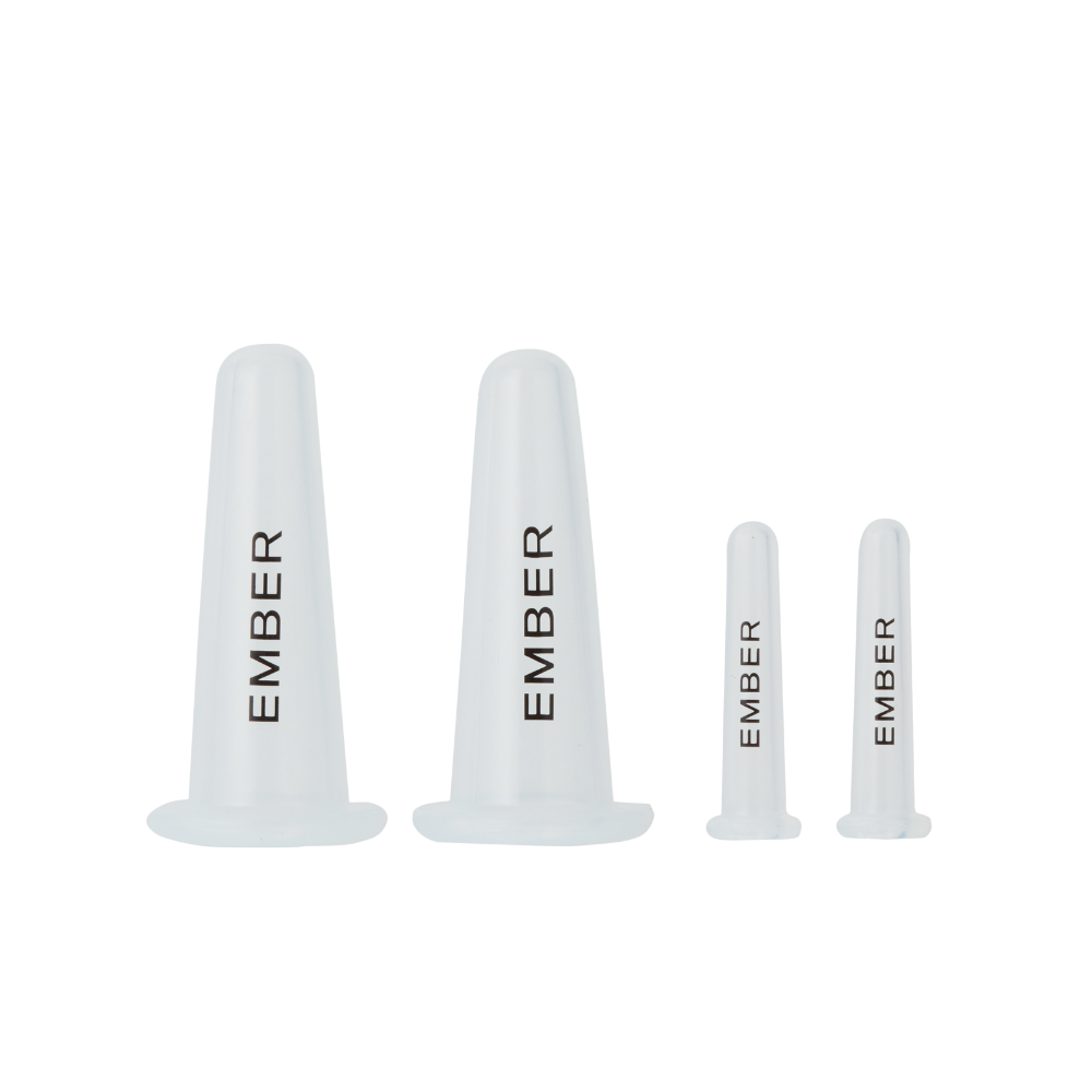 Set of face cups with 'EMBER' branding on a white background