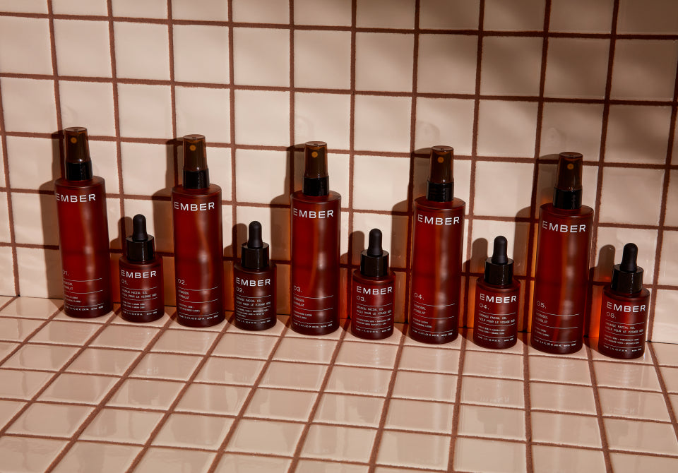Ember's facial oils and hydrosols lined up on a tiled surface. Ember's oil and water duos combine to deliver the maximum amount of nutrients to the skin leaving your skin perfectly balanced, beautiful, and supported.