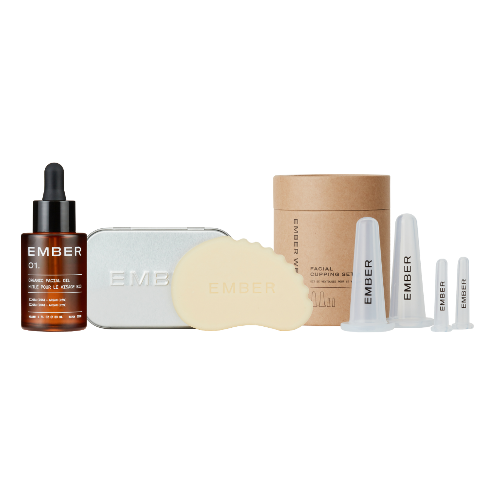 Collection of Ember skincare products including a bottle, cream, and packaging on a white background