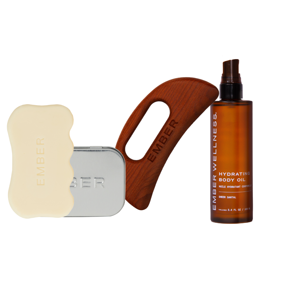 Skincare products including a serum bar, sculpting tool, and bottle on a white background