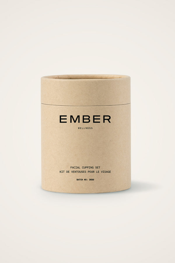 Cylindrical packaging for Ember's face cupping set.