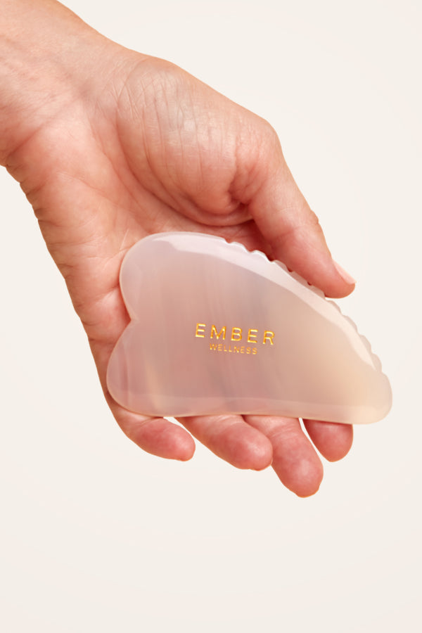 Our patented Heart Gua Sha tool designed for optimal facial support, seen here in agate.